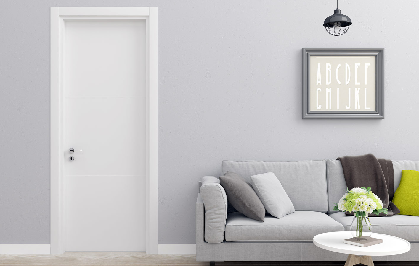 Ausschnitt Raum mit weißer Tür und modernem Sofa grau